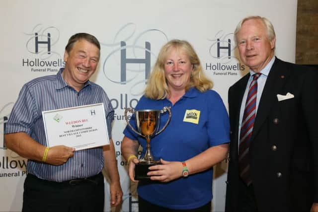 Weedon Bec -  Overall 2015 Best Village Competition Winner and winner of the Large sized Villages. Photo shows John Wilshire & Sue Butler receiving the Winners Cup from David Laing, HM Lord- Lieutenant & President of Northamptonshire ACRE