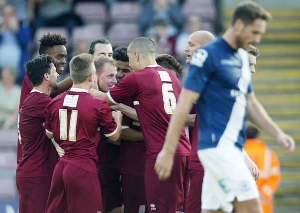 CELEBRATION - Nicky Adams is mobbed by his Cobblers team-mates following his goal against Birmingham City (Pictures: Kirsty Edmonds)
