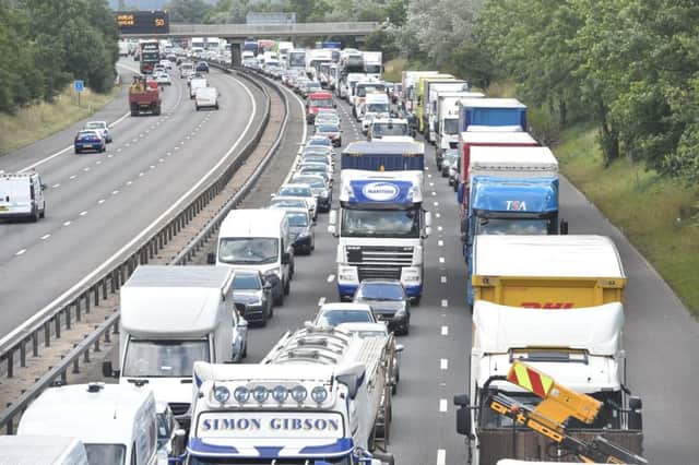 Motorists are facing long delays after a three-car crash on the M1