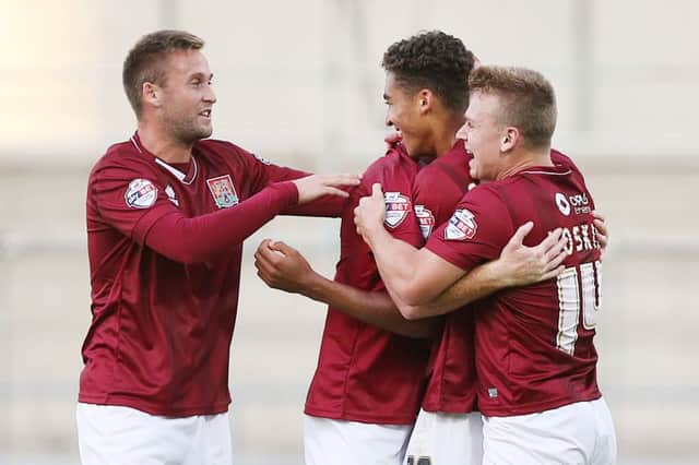 Cobblers players celebrate. Picture by Kirsty Edmonds