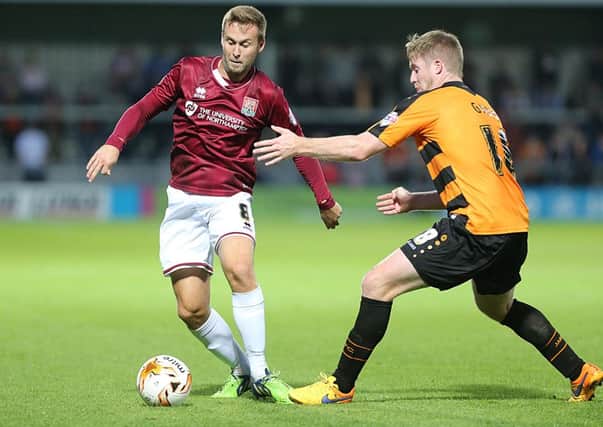 NO WAY THROUGH - Joel Byrom looks for an opening in the Cobblers' 2-0 defeat at Barnet (Pictures: Kirsty Edmonds)