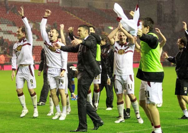MEMORABLE NIGHT - Ian Sampson and his players celebrate the league cup win at Liverpool in September, 2010