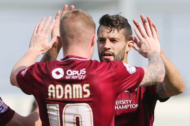 Marc Richards and Nicky Adams celebrate after the two combined to put Northampton ahead (pictures by Kirsty Edmonds)