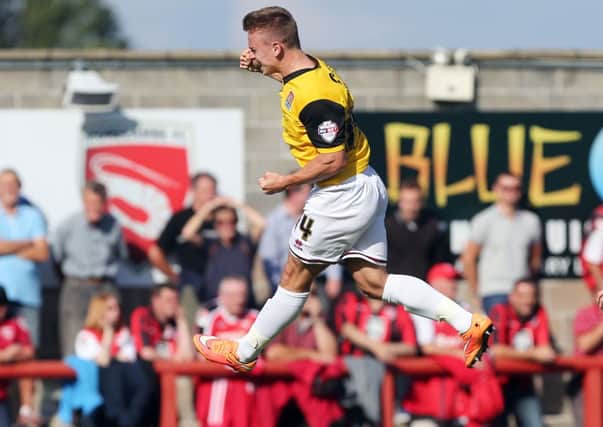 FLYING HIGH - Sam Hoskins celebrates firing the Cobblers 2-0 ahead at Morecambe (Picture: Kirsty Edmonds)