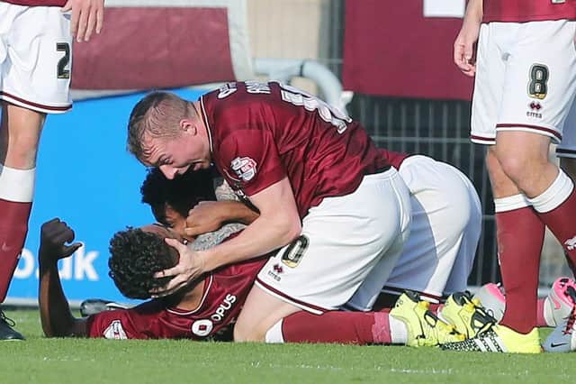 Northampton players celebrate after Dominic Calvert-Lewin's late header (pictures by Kirsty Edmonds)