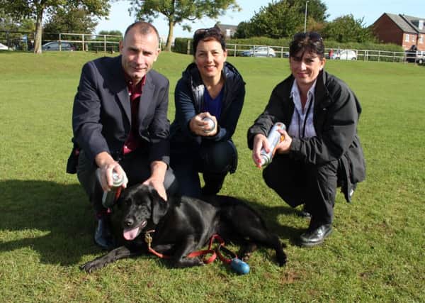 From left: Environmental Health Improvement Manager at Daventry District Council Paul Knight, Cllr Sandra Moxon of Brixworth Parish Council and Lisa Hudson-Fryer from Daventry District Councils Environmental Health Team with Clancy the dog at St Davids Playing Fields in Brixworth.
