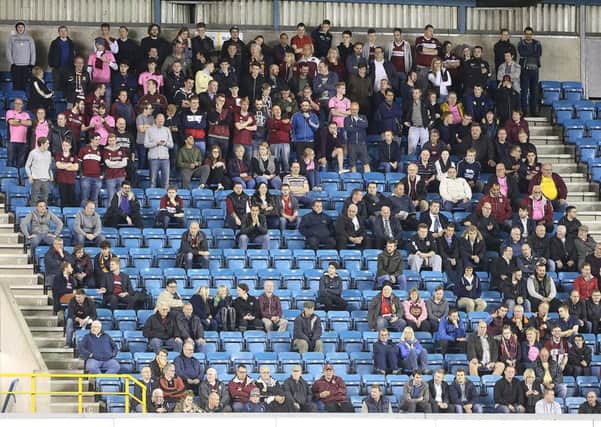 DECENT TURNOUT - some of the 212 Cobblers supporters that made the trip to Millwall on Tuesday night (Picture: Kirsty Edmonds)