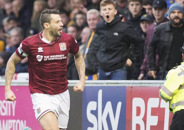PICK THAT ONE OUT - Marc Richards enjoys his fourth-minute goal on Saturday a bit more than the watching Mansfield fans (Picture: Kirsty Edmonds)