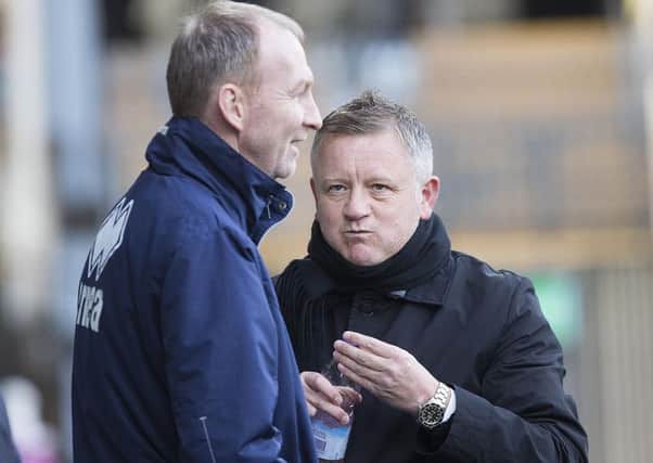 Alan Knill and Chris Wilder share a joke during Saturday's 2-1 win at Notts County (Picture: Kirsty Edmonds)