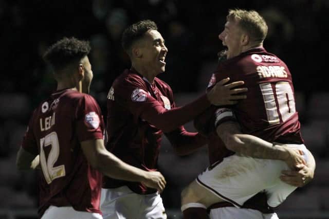 Nicky Adams, Dominic Calvert-Lewin, Josh Lelan and Marc Richards celebrate after Northampton go 2-0 up over Yeovil.  Pictures by Sharon Lucey