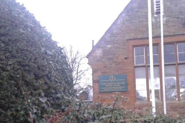 Flore Primary School, with the yew tree to the left of the picture