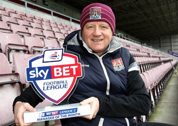 TOP BOSS - Chris Wilder with his Sky Bet League Two manager of the month award