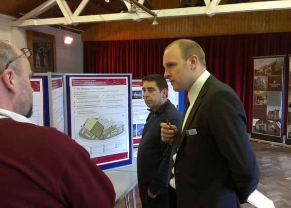 A public meeting at West Haddon Village Hall in 2014 to discuss new homes being put forward by a developer