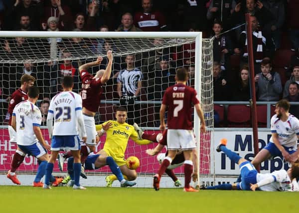PILING ON THE PRESSURE - the Cobblers press for a goal in the clash with Portsmouth on Saturday