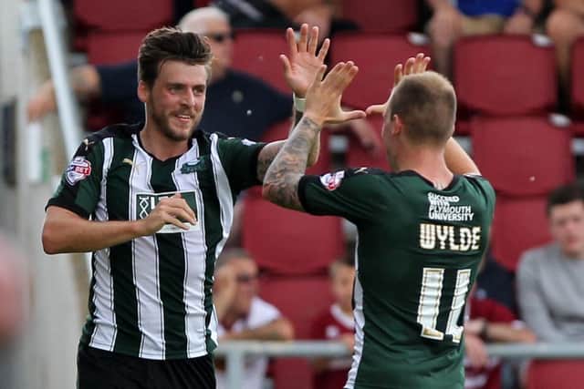 Graham Carey celebrates firing Plymouth into the lead at Sixfields
