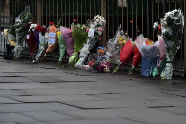 MNCE Anytime. Pic of flowers at scene of murder in Barrack Road, near Lazeez restaurant. CJO NNL-150121-114055009