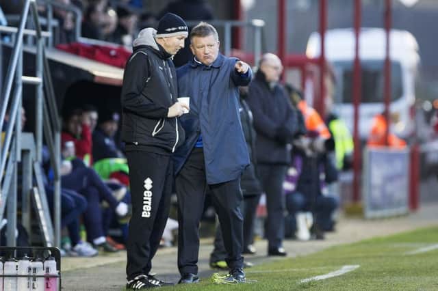Chris Wilder and Alan Knill discuss tactics during Saturday's game at Dagenham (picture by Kirsty Edmonds)