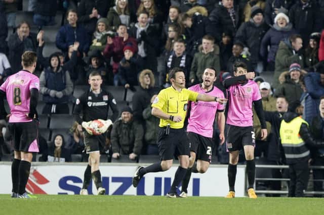 Referee Tony Harrington points to the spot for the second of two contentious Dons penalties (pictures by Kirsty Edmonds)