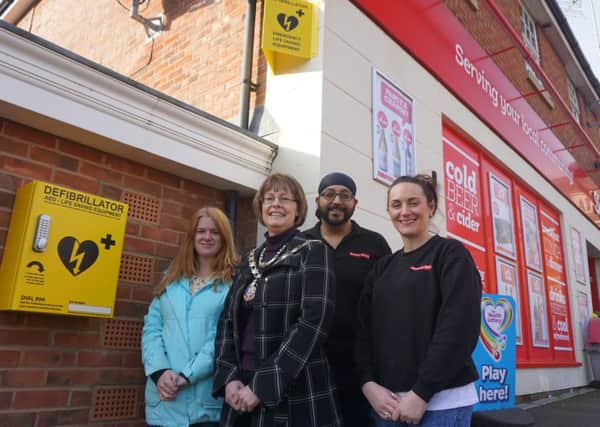 From left, Karen Tweedale secretary of the residents' association, Cllr Wendy Randall from Daventry Town Council, and from the Select Convenience store, owner Davinder Parhar and Gail Howes.