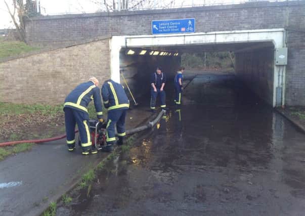 Some of the crew working to clear the underpass