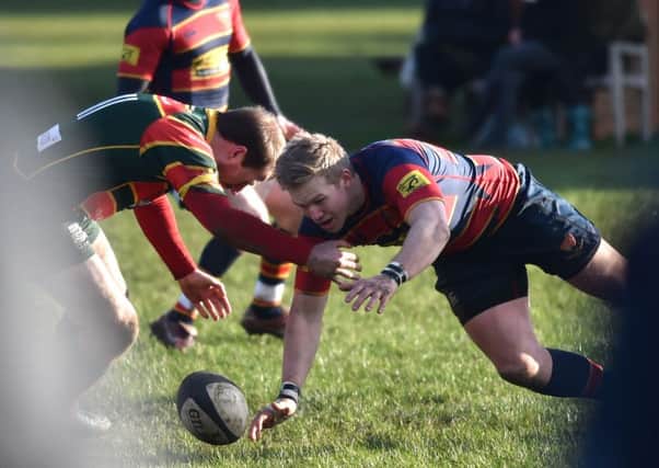 BATTLING FOR POSSESSION - action from ONs' narrow defeat to Sandbach
