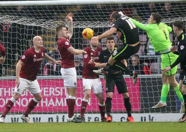 IN THE THICK OF THE ACTION - Ryan Cresswell (left) was delighted to be back in the Cobblers team on Saturday (Picture: Sharon Lucey)