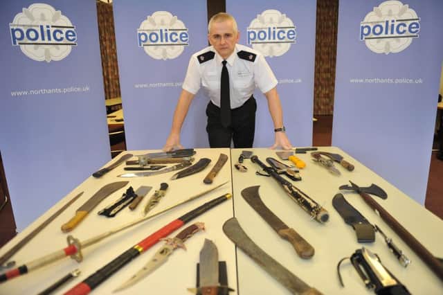 Superintendent Mick Stamper, head of Northampton Operational Command Unit, at Northants Police with some of the knives collected during a recent knife amnesty.