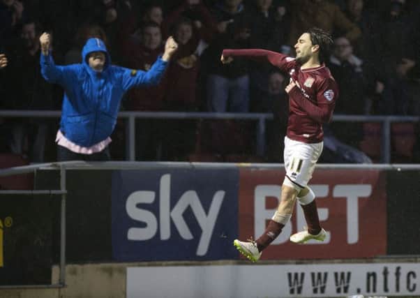 JUMPING FOR JOY - Ricky Holmes celebrates his goal in the 3-0 win over Barnet on January 2