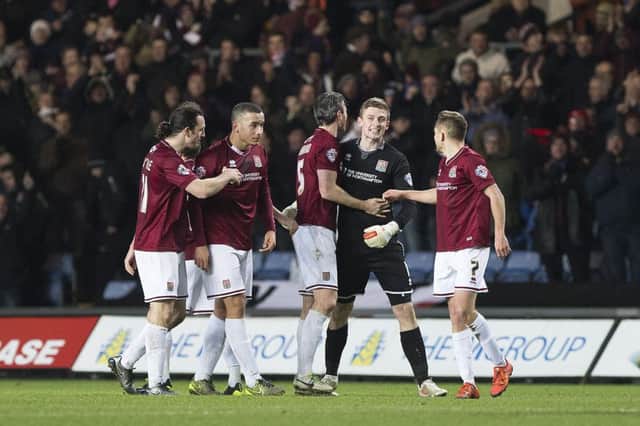 TEAM EFFORT - the Cobblers players celebrate their 1-0 win at Oxford United (Picture: Kirsty Edmonds)