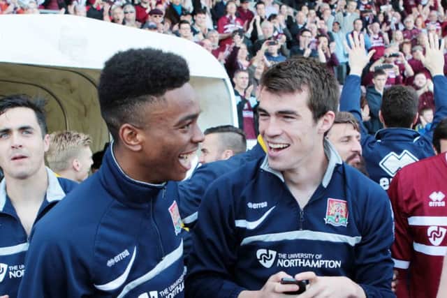 HAPPY MEMORIES - John Marquis celebrates the Cobblers' final-day survival with Ivan Toney in 2014