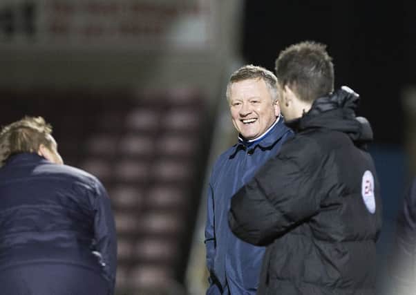 Chris Wilder and Neal Ardley share a joke on the touchline (pictures by Kirsty Edmonds)