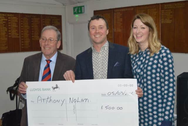 Presenting money to the Anthony Nolan Trust.