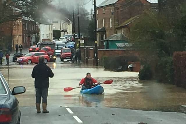 A man used a canoe to ferry people across Yelvertoft High Street