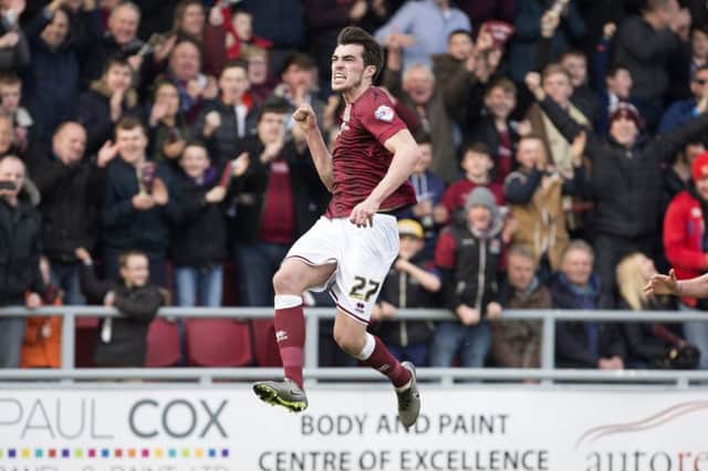 Jumping for joy: John Marquis celebrates after heading Northampton in front (pictures by Kirsty Edmonds)
