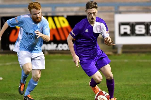 Daventry Town's Jetmir Esson comes away with the ball during Tuesday's derby at Rugby Town. PHoto: Martin Pulley