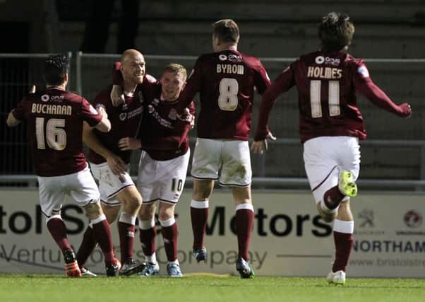 PLENTY OF QUALITY - Jason Taylor, pictured celebrating his goal in the FA Cup win over Northwich in December, believes the Cobblers squad is already well prepared for life in league one next season
