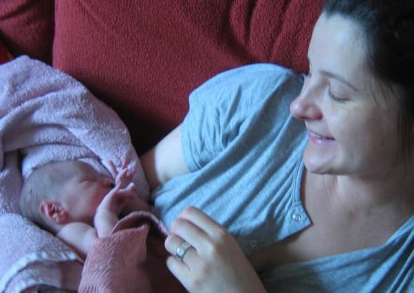 Marie Teale with newborn Orlaith.