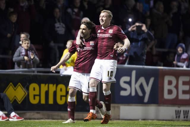 HIT THE FRONT: Nicky Adams won the penalty which Ricky Holmes converted to put Cobblers ahead. Pictures: Kirsty Edmonds