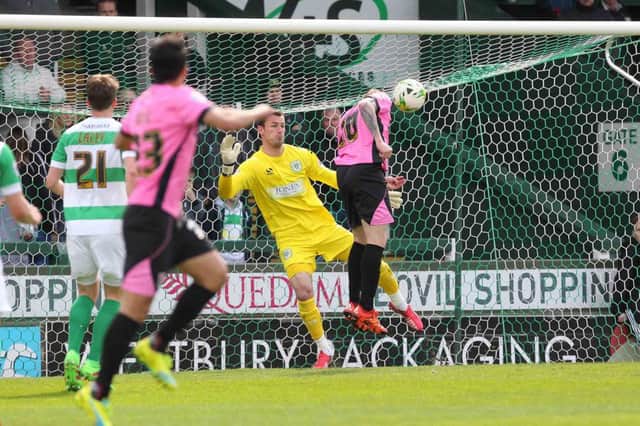 ALL SQUARE: Nicky Adams heads in Northampton's equaliser against Yeovil. Picture by Sharon Lucey