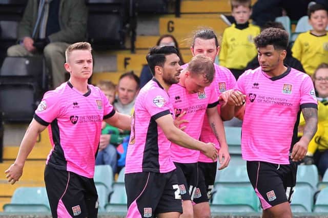 Cobblers congratulate Nicky Adams on his goal (pictures by Sharon Lucey)