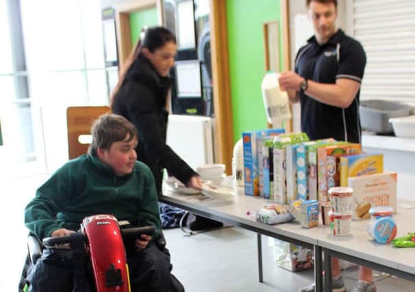 One of the UTC's students at the breakfast scheme