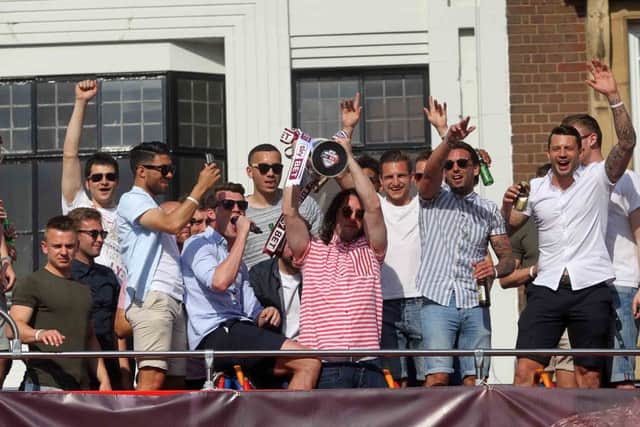 Cobblers victory parade. NNL-160805-185408009