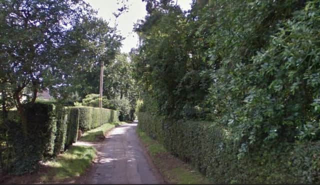 A man indecently exposed himself to a dog walker in fields off Golf Lane, Church Brampton.