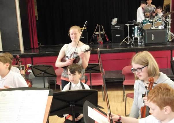 Young members of Daventry Music Centre performing.