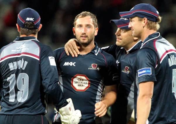 MAGICAL MEMORY - Steven Crook is congratulated after claiming a wicket in the 2013 T20 final win over Surrey