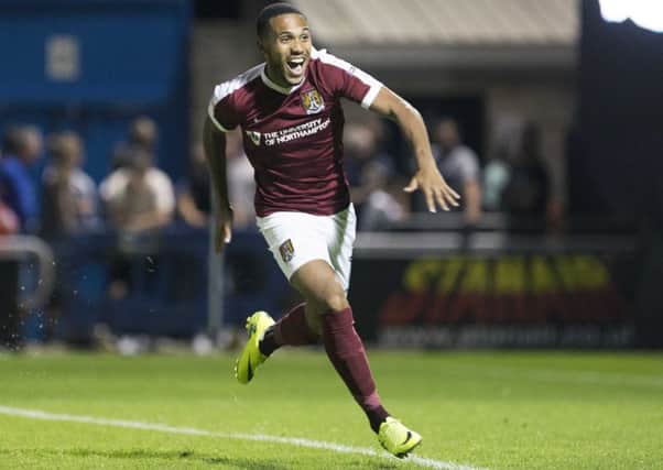 ON THE SPOT! - Kenji Gorre runs away to celebrate after slotting the winning penalty against West Brom (Pictures: Kirsty Edmonds)