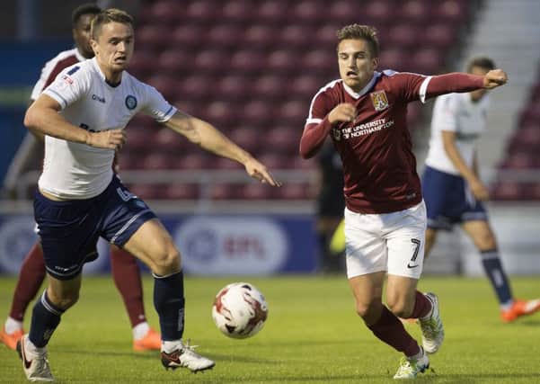 THE CHASE IS ON - Lawson D'Ath battles for possession during the Cobblers' EFL Trophy clash with Wycombe (Pictures: Kirsty Edmonds)