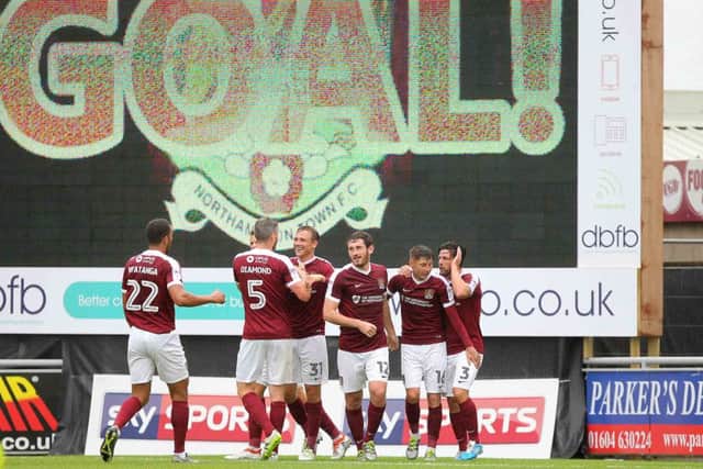 Northampton players celebrate after Matty Taylor headed them in front. Pictures: Sharon Lucey