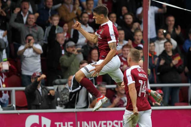 JUMPING FOR JOY: Alex Revell celebrates his successfully converted spot-kick. Pictures: Sharon Lucey