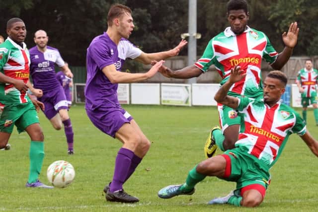 Daventry Town's  Jordan Orosz and Windsor's Ricardo Cannon compete for the ball during Saturday's FA Vase tie